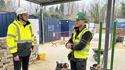Ian talking to someone at the National House Building Council Training Hub in Impington