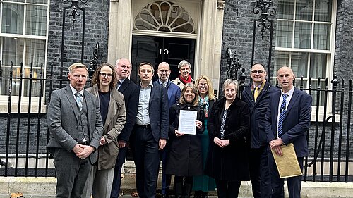 Ian and a group of people outside 10 Downing Street