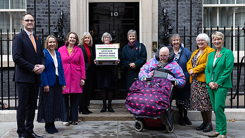 People standing outside the door of no 10 holding the petition