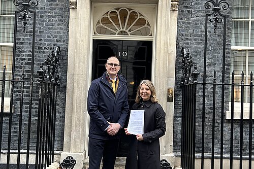 Ian Sollom and Jo Sale delivering the IB funding letter