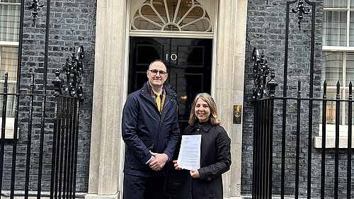 Ian Sollom and Jo Sale delivering the IB funding letter
