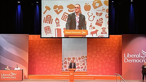 Ian Sollom onstage at the September 2025 Lib Dem conference